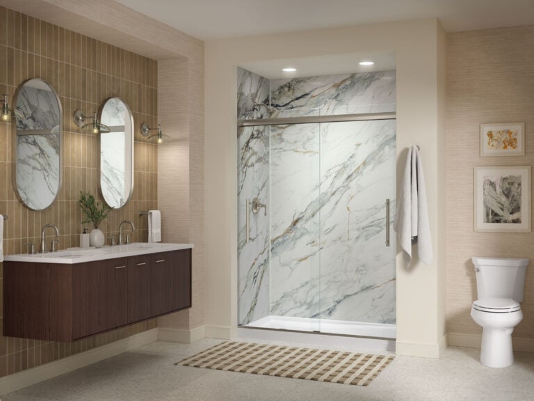 Photo of a KOHLER shower with Calacatta Gold shower walls