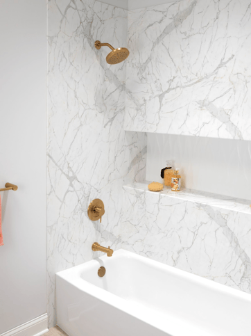 Photo of a walk in shower with BCI Acrylic Santorini White walls